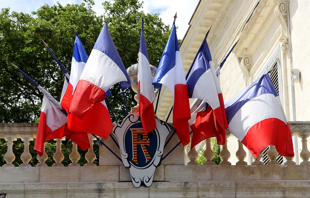 Multiple French flags waving, symbolizing France’s superpower and global influence