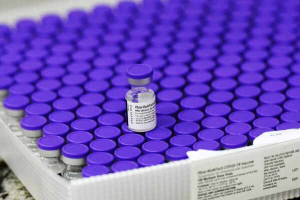 Poland and Romania -Pfizer COVID-19 vaccine vial representing potential conversion of vaccine debt into medicines for Romania and Poland.