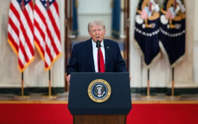 Donald Trump speaking during a formal public event, representing his presidency and fact-check findings on 30,573 false or misleading claims (bdesk.news)