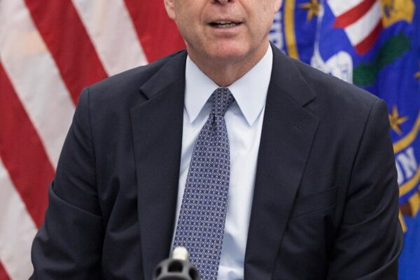 Portrait of James Comey, former FBI Director, featured in an article about his recent indictment and alleged threats against Donald Trump on bdesk.news