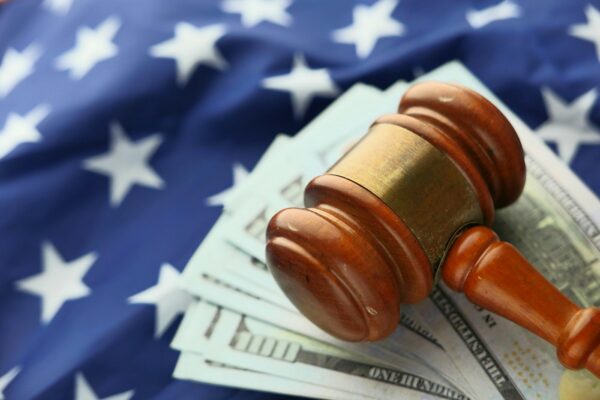 Judge’s gavel in courtroom symbolizing Belgian court ruling forcing Poland and Romania to pay Pfizer $1.7 billion for COVID-19 vaccine contracts